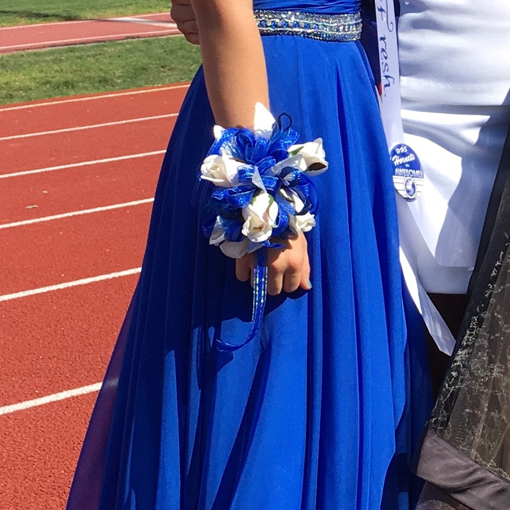Royal blue, white, and silver corsage